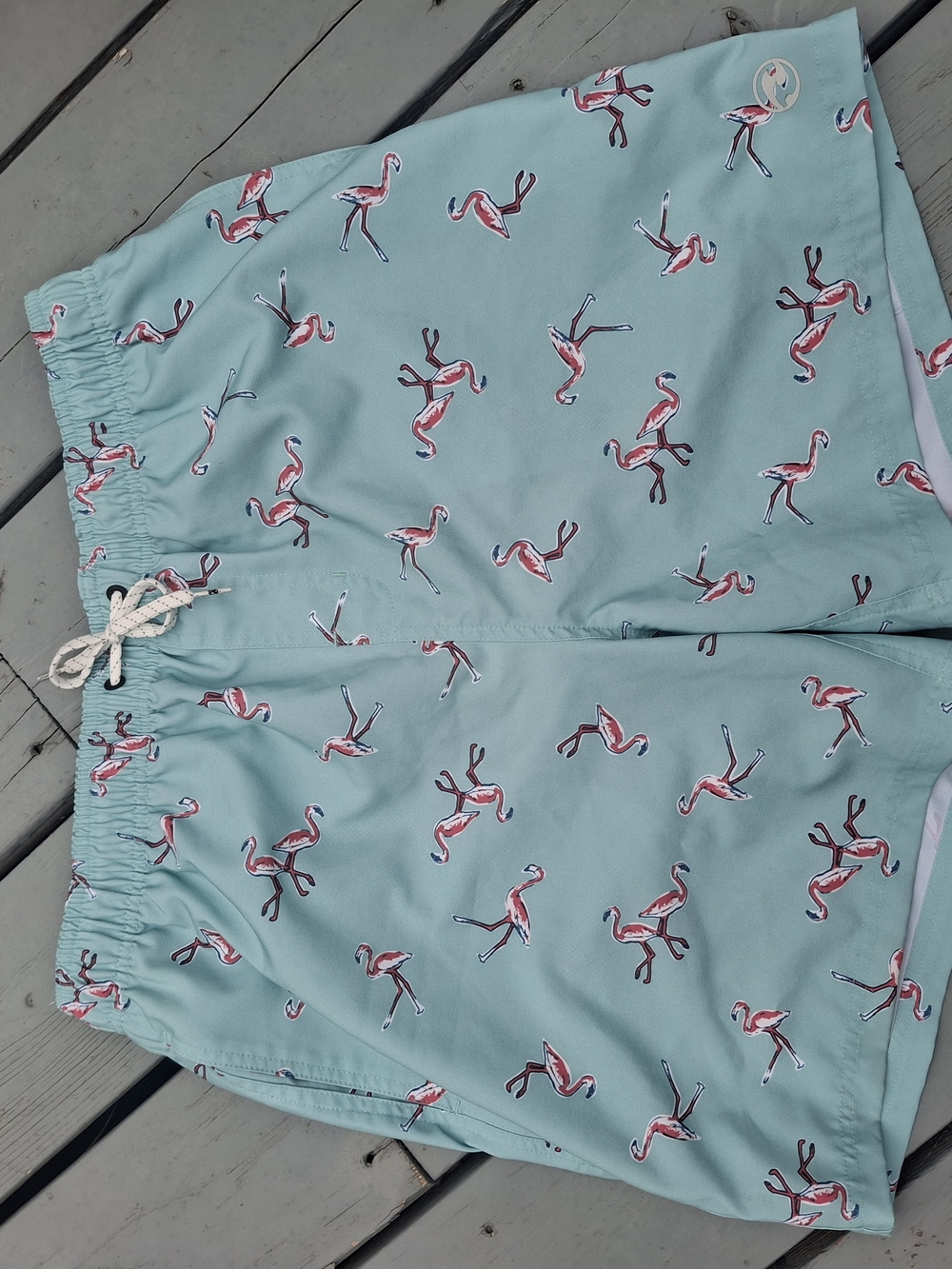 Ocean Current Mint Green Swim Trunks with Pink Flamingo Print
